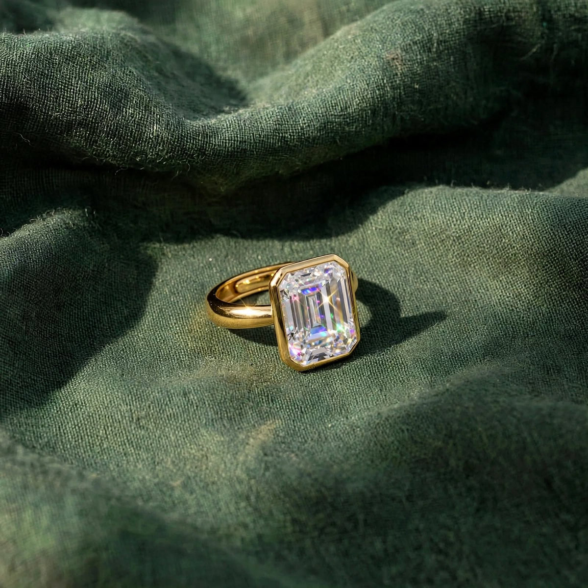 Emerald-Cut Bezel Set Solitaire Moissanite Ring in Yellow Gold 375LV5